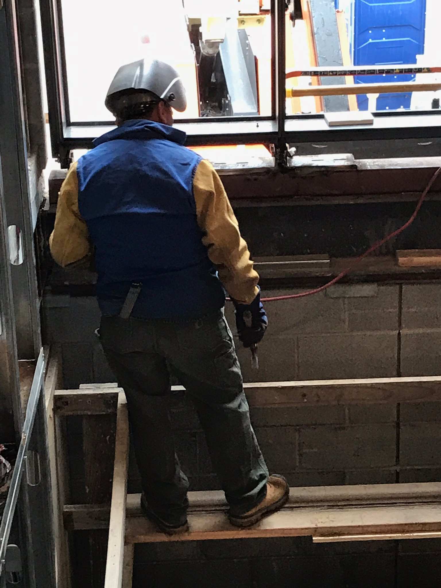 General contractor reviewing building plans on a job site in Victor, ID