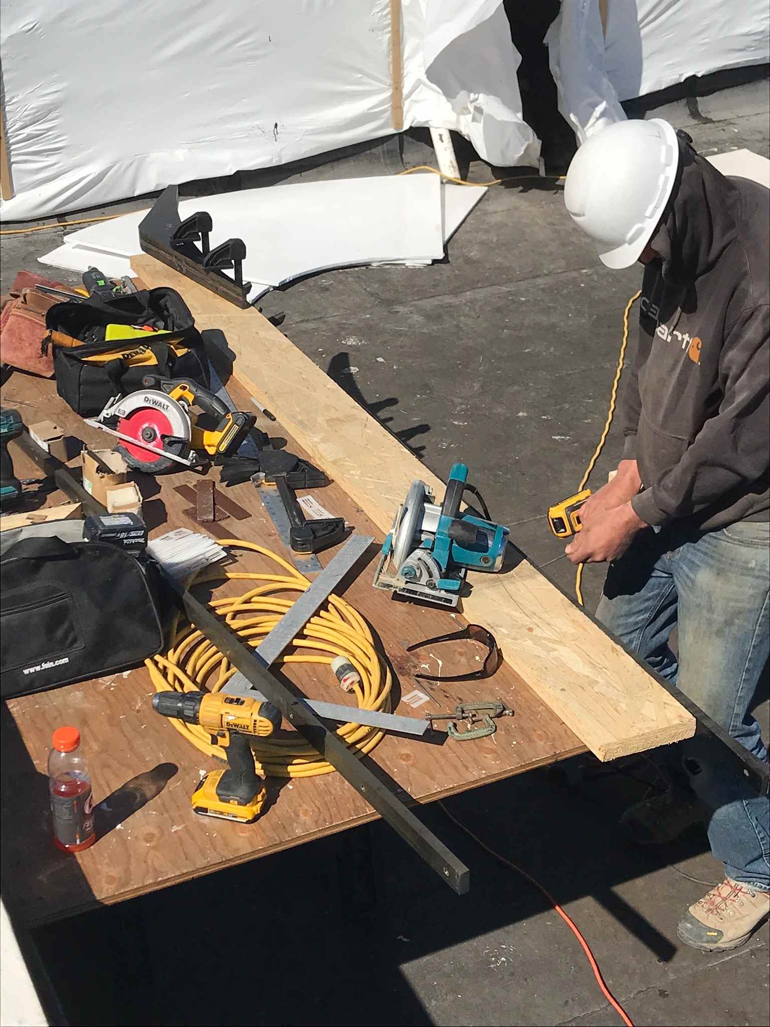 Remodeling contractor checking a wall for level during a home renovation in Victor, ID