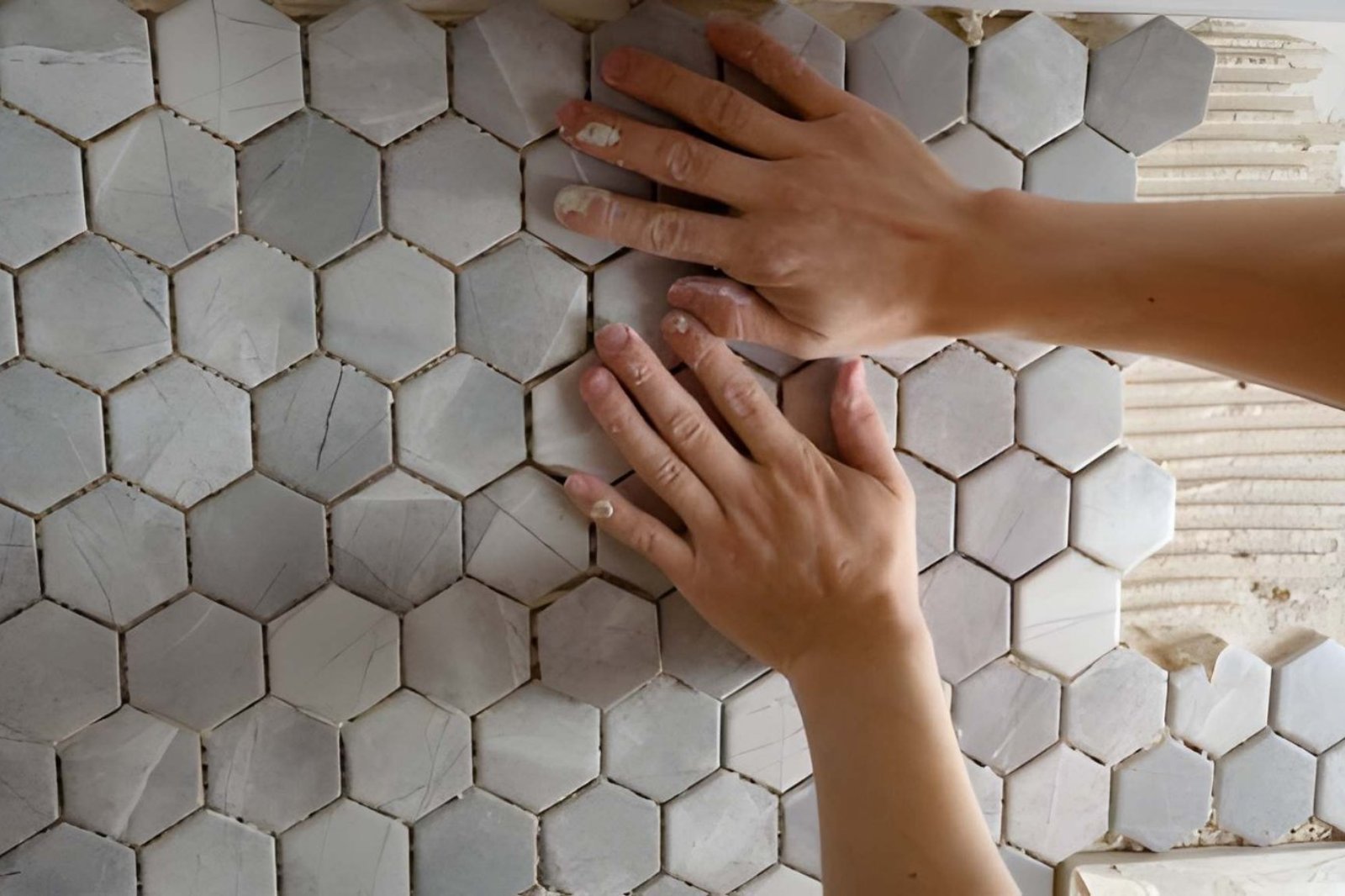 Level tile floor with straight grout lines in a Victor bathroom remodel
